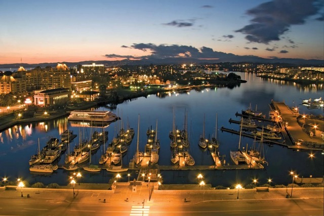 view of Victoria city in British Colombia with boats on the lake 